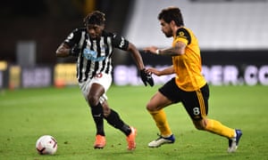 Alan Saint-Maximin of Newcastle is challenged by Robin Neves.