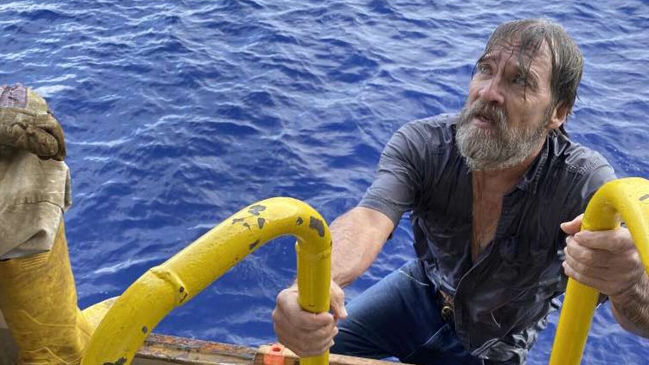 After 24 hours in the waters off Florida, he found the man clinging to an inverted ship.