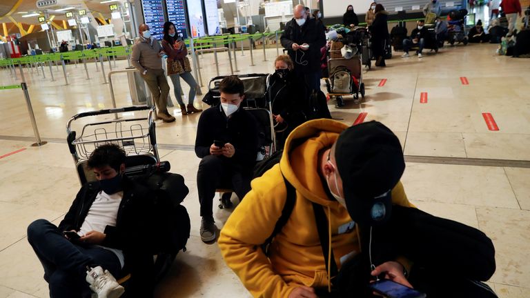 Passengers stranded awaiting news of their flights at Adolfo Suarez-Barajas Airport