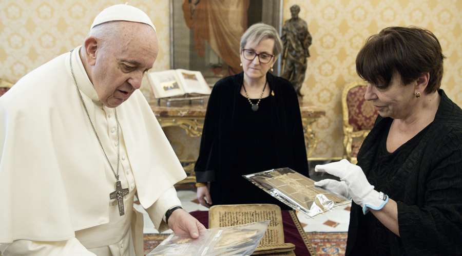 Pope Francis shows the Bible as Sidra from Qaraqosh, Iraq