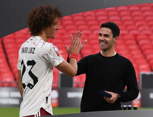 Arsenal's David Luiz raises five years to Arsenal coach Mikel Arteta after the FA Community Sheild match between Arsenal and Liverpool at Wembley Stadium on August 29, 2020 in London, England.
