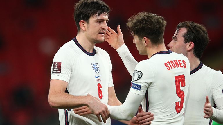 John Stones embrace Harry Maguire after the win