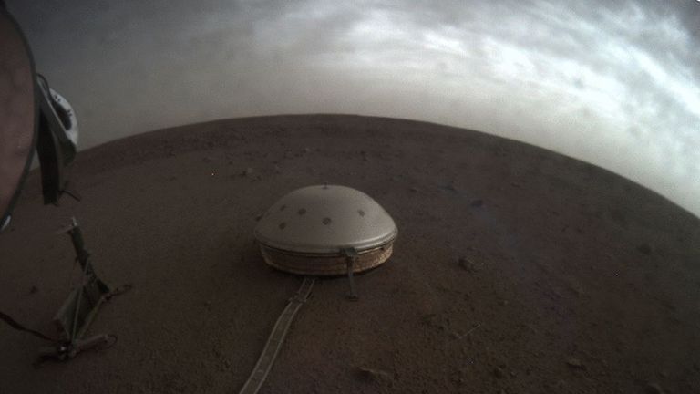 Clouds drift above a dome-covered seismometer, known as SEIS, of NASA's Insight spacecraft, on the surface of Mars.  Pic: NASA / JPL-Caltech
