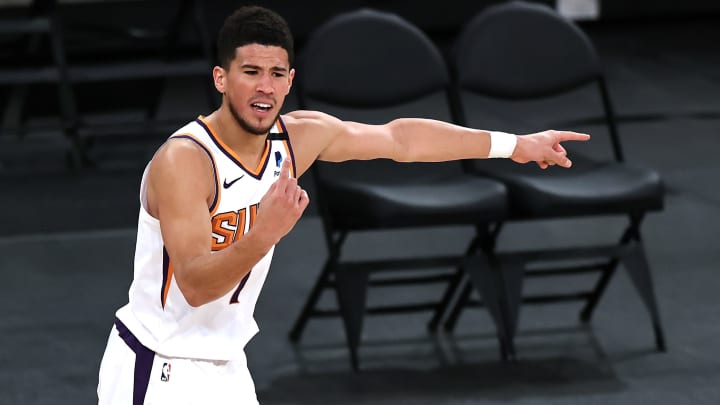 Devin Booker handing out tickets to Suns fans