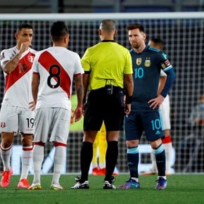 Messi pushes the Brazilian referee
