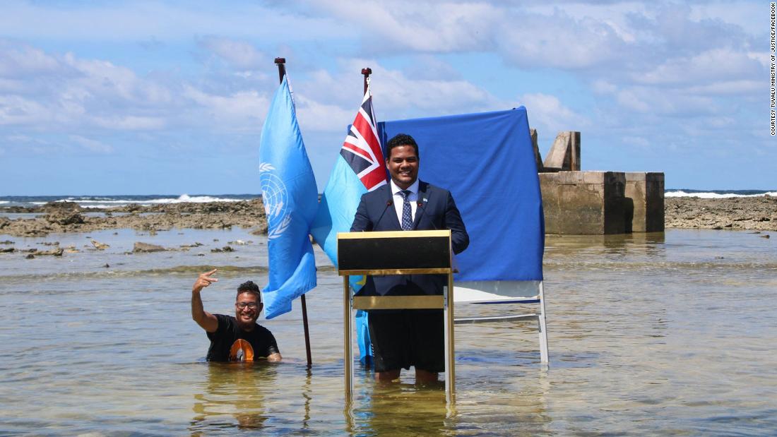 Tuvalu Minister goes to the water to film his speech at COP26