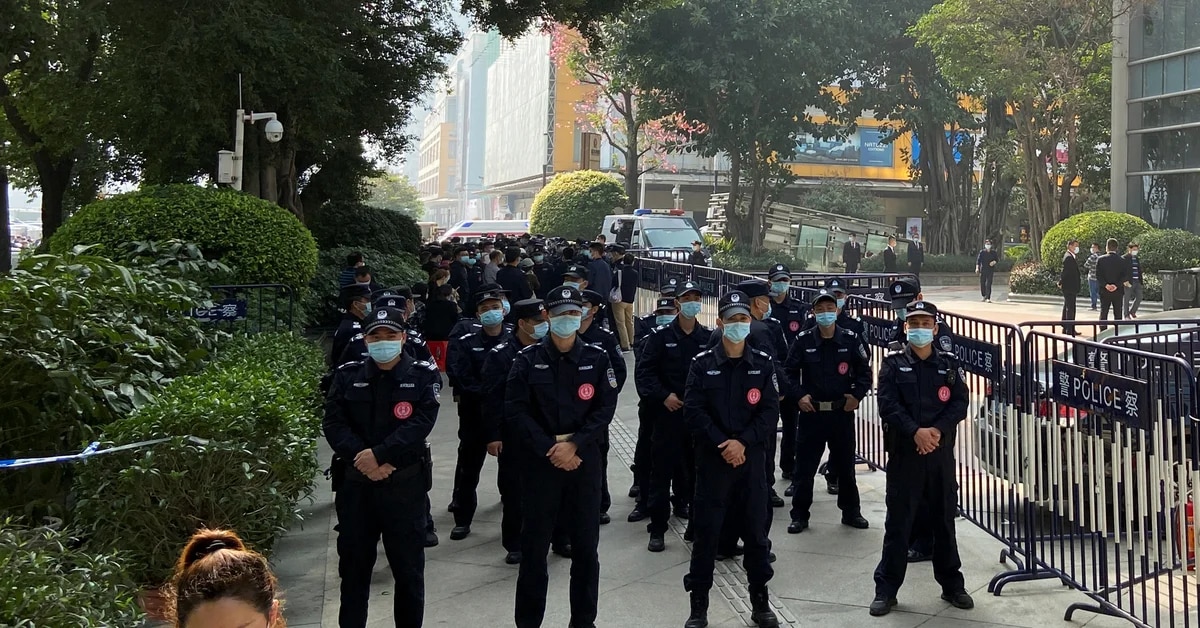 ‘Get our money back!’: Evergrande investors protest as Chinese police protect offices of giant real estate company