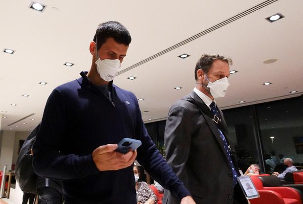 Serbian tennis player Novak Djokovic walks into Melbourne airport before boarding a plane after a federal court upheld the government's decision to cancel his visa to play in the Australian Open on January 16, 2022 in Melbourne, Australia.  REUTERS / Loren Elliott TPX Pictures OF DAY