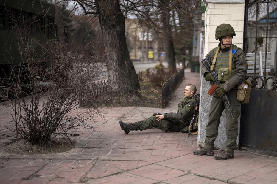 A Ukrainian soldier sits after being wounded in a fight with the Russian army.