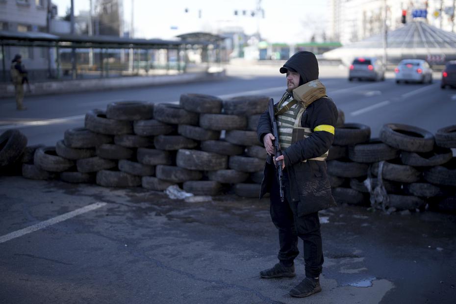 Civil Defense personnel at a military checkpoint in Kiev.