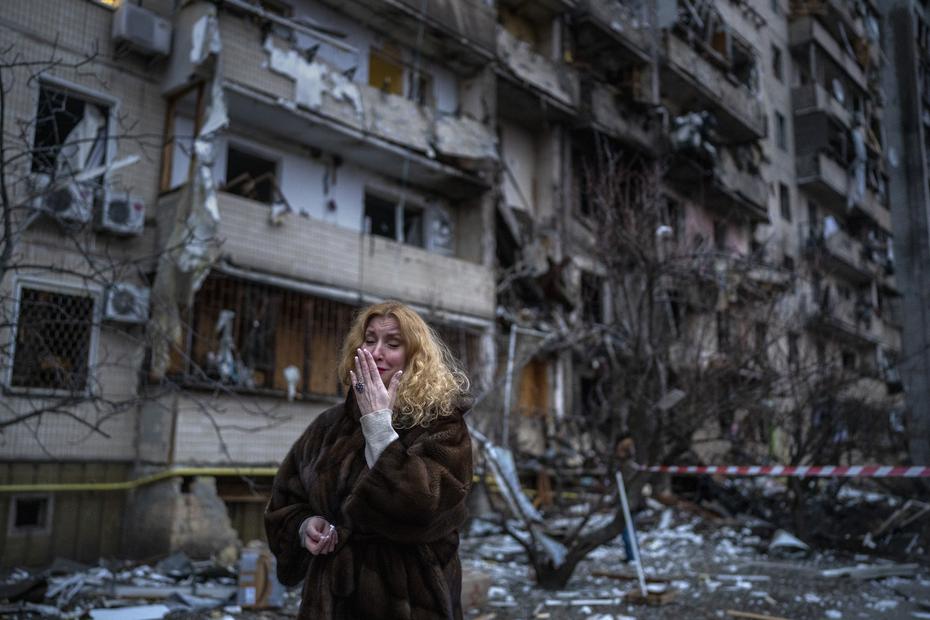 A woman responds as she cries to see her home destroyed by a missile fired by Russian forces in Kiev.