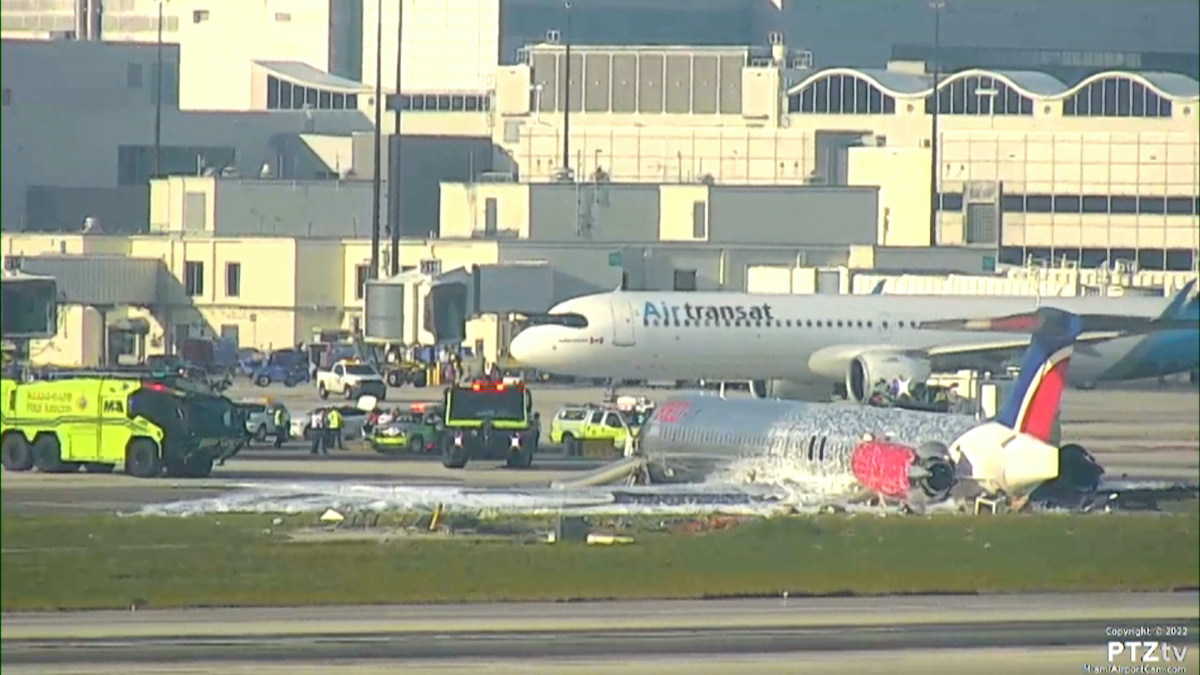 Three people have been admitted to hospital after a commercial plane caught fire at Miami International Airport