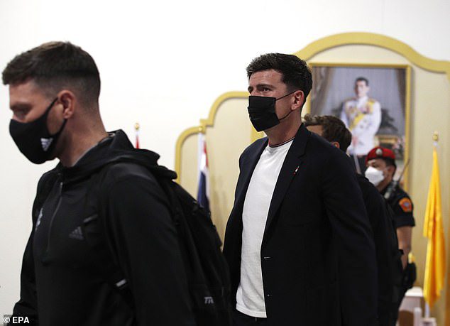 Ten Hag has confirmed that Harry Maguire (right) will remain captain of Manchester United