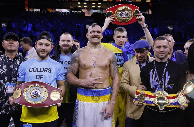 Oleksandr Usyk celebrated with his team last Saturday after retaining his heavyweight belts against Anthony Joshua (Reuters/Andrew Canridge)