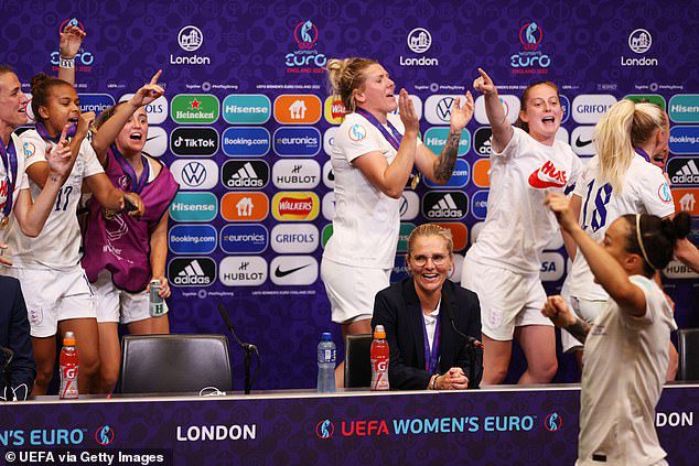 England players form conga streak around Sarina Weigman after Euro 2022 . win